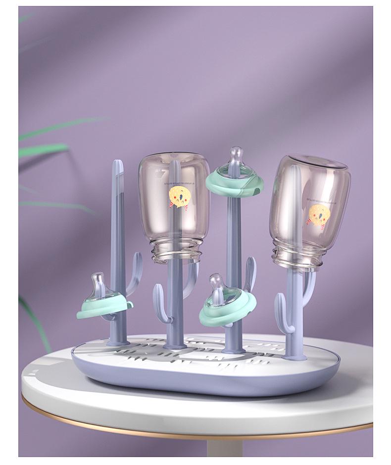 Versatile Baby Bottle Holder & Detachable Drying Rack with Pacifier Slot.