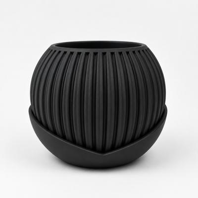 Black, Striped Flowerpot with a Modern, Decorative Saucer