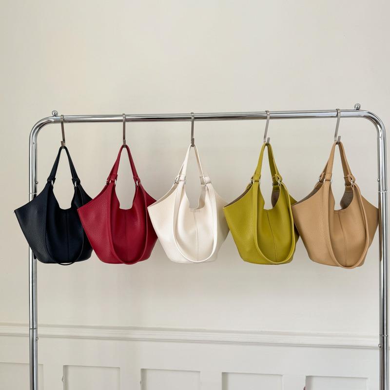 Niche high-end soft leather vegetable basket hand carrying bucket bag women's new commuter shoulder armpit bag