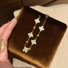 Pulsera de Trébol de Cuatro Hojas Láser Hielo Triturado Dorado Intermitente - Joyería Retro de Lujo para Mujeres