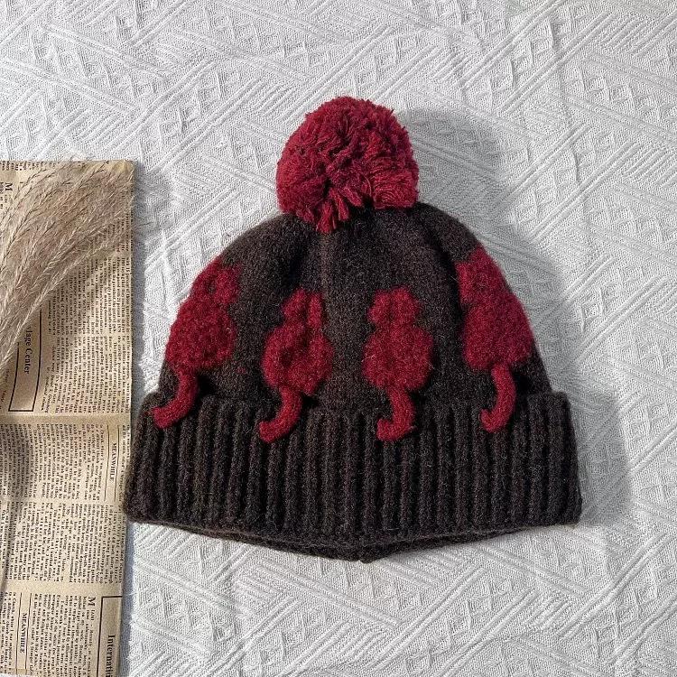 Cute three-dimensional cat jacquard wool hat female winter warm cold ear protection windproof color matching hairball knitted cold hat