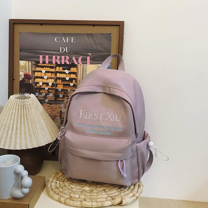 School bag Korean version ins style versatile junior high school student school bag solid color letter backpack high value simple lightweight backpack