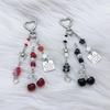 Modern Cherry Themed Keychain Accessory Crafted From Sturdy Materials Perfect For Adding Flair To Any Ensembles