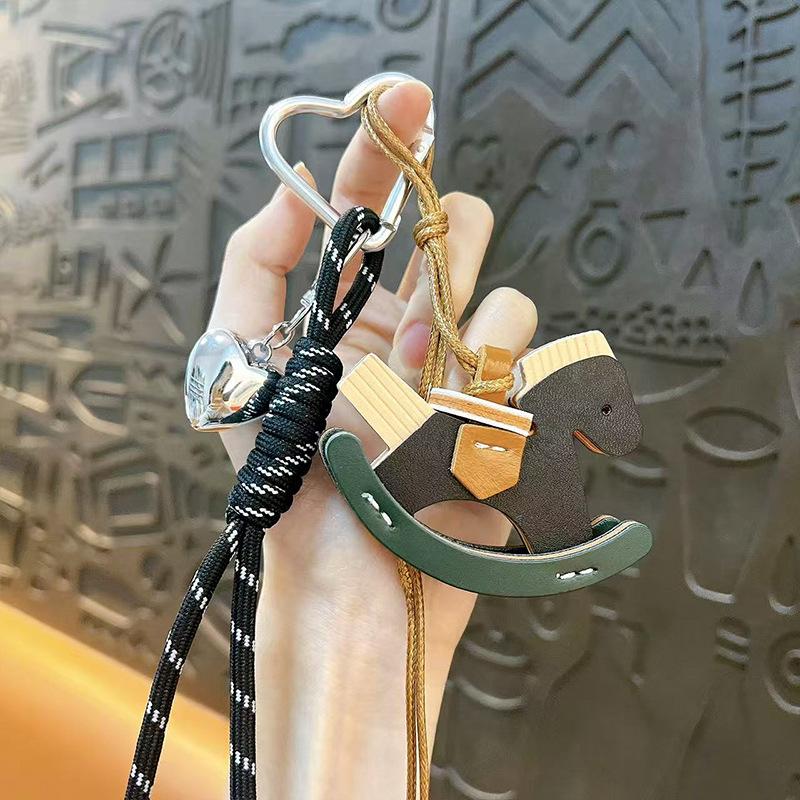 Creative leather rocking horse keychain cute trendy cool PU Trojan horse pendant men and women versatile bag hanging accessories small gifts