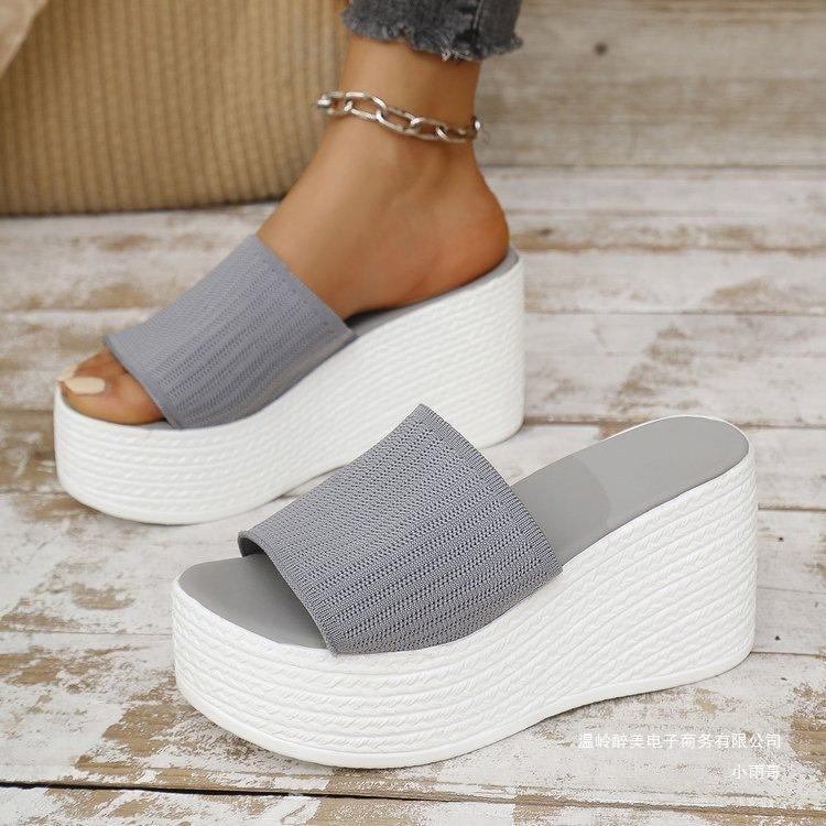 2025 summer new large size solid color wedge heel one-word slippers women wear thick-soled knitted mesh wedge heel cool slippers
