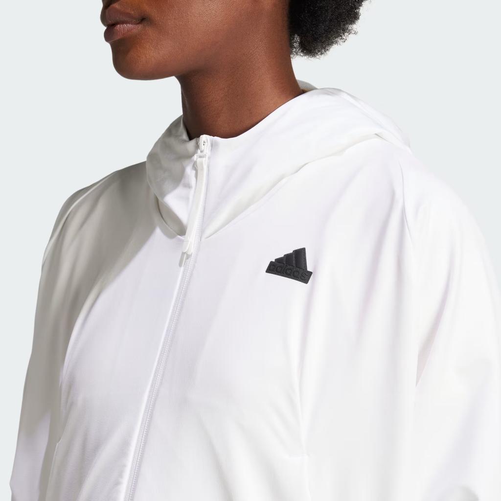 Adidas ZNE. Dámská tkaná mikina s kapucí na zip a monochromatickým logem bílá IN9483