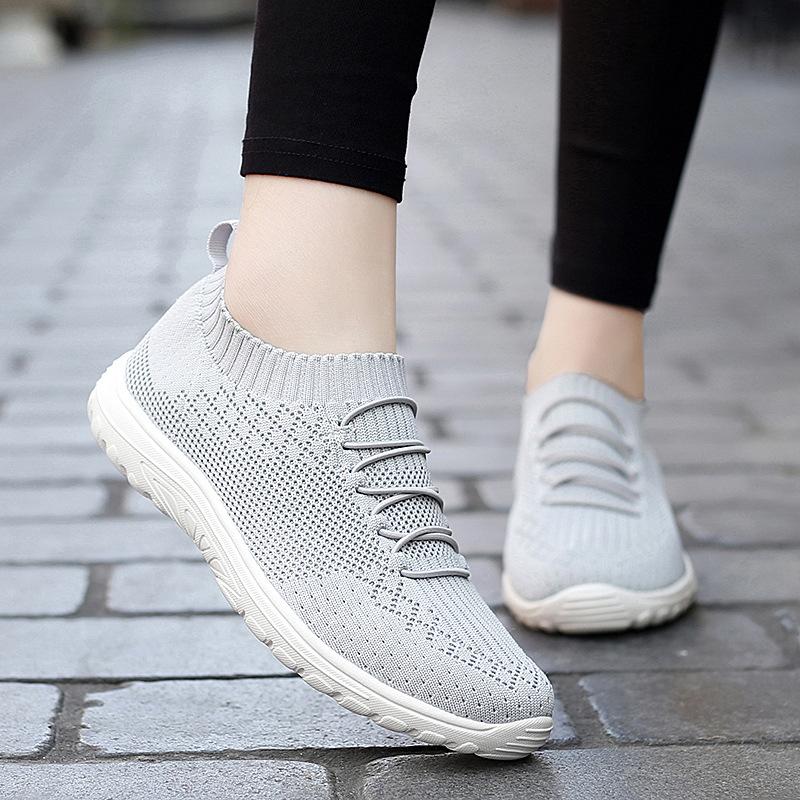 Large size spring and summer flying weaving one pedal mesh breathable lazy shoes hollow casual sports socks shoes women