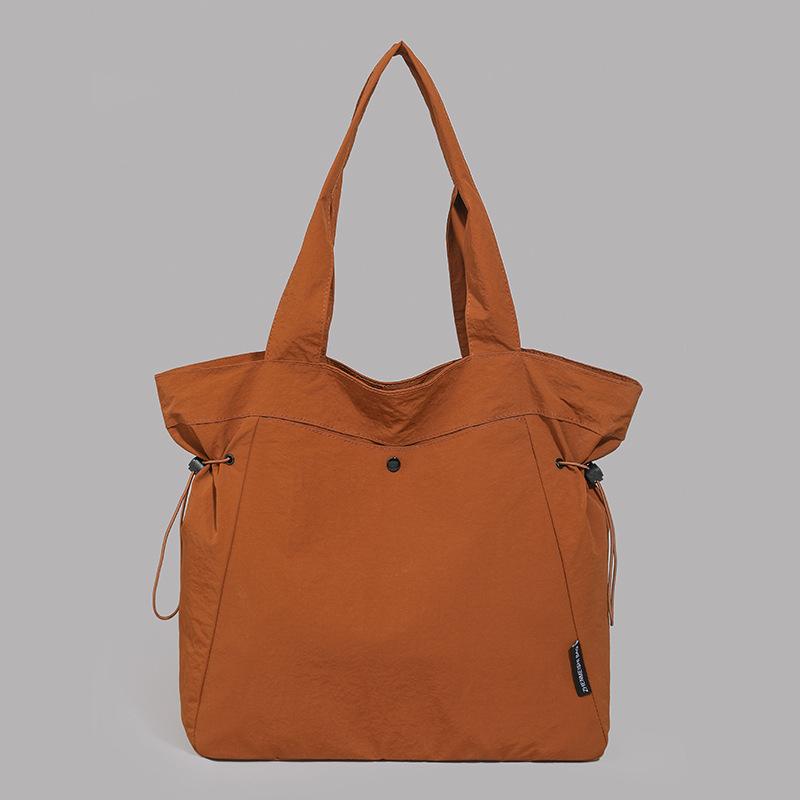 Simple and fashionable 2025 summer new fashion shoulder bag women's casual solid color large-capacity tote commuter bag