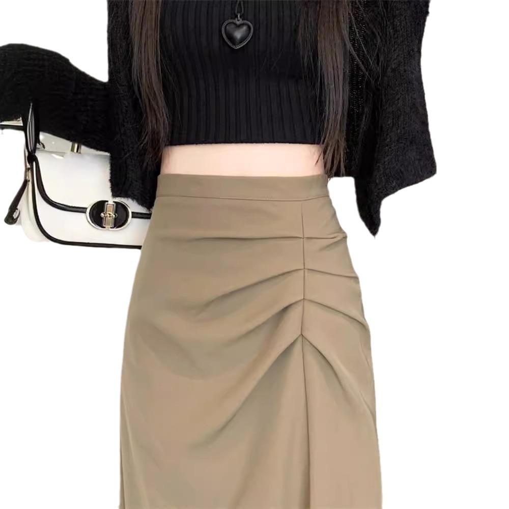 Dámská midi sukně áčkového střihu s vysokým pasem a rozparkem pro raný podzim 2025