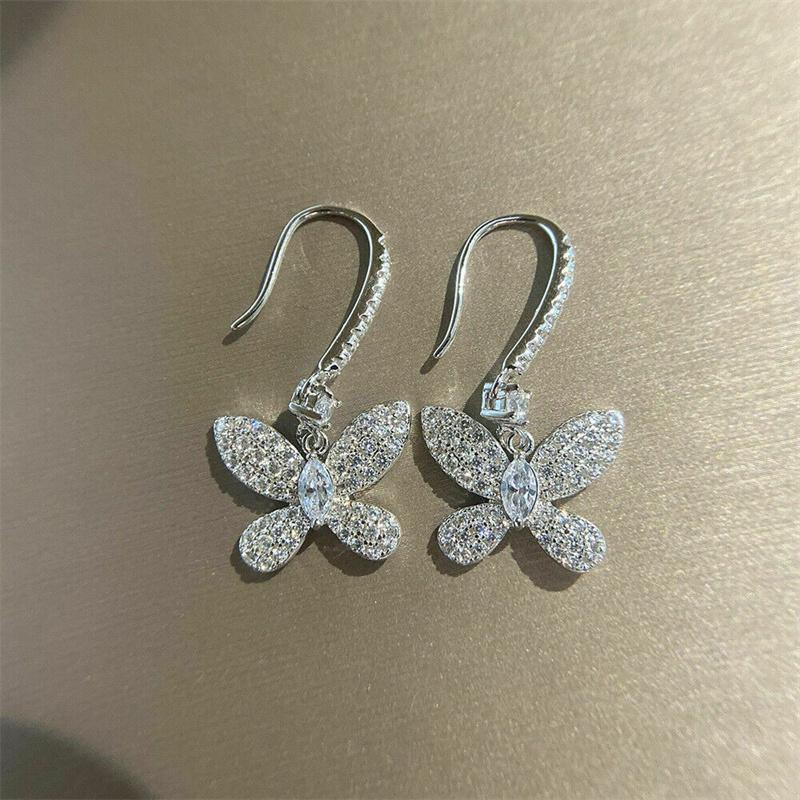 Pendientes colgantes Huitan de moda con mariposa y circonita cúbica para mujer, exquisitos accesorios para orejas de niña, color plateado, joyería llamativa