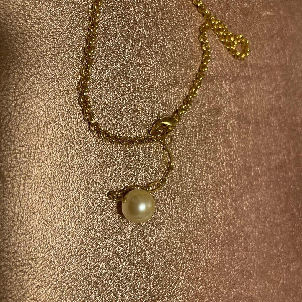 Used Q-POt banana chocolate necklace