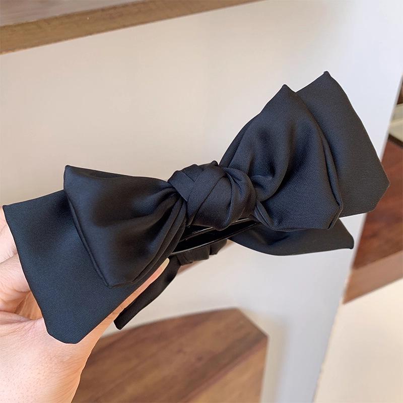 This Season s Favorite: Elegant Bow Bun Hair Clip - High Ponytail Fixing Claw for a High-End Look.