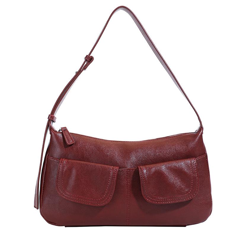 

Крутая и пикантная женская сумка с множеством карманов 2025 новая весенне-летняя дорожная портативная на плечо подмышку ретро премиум нишевая сумка бордовый