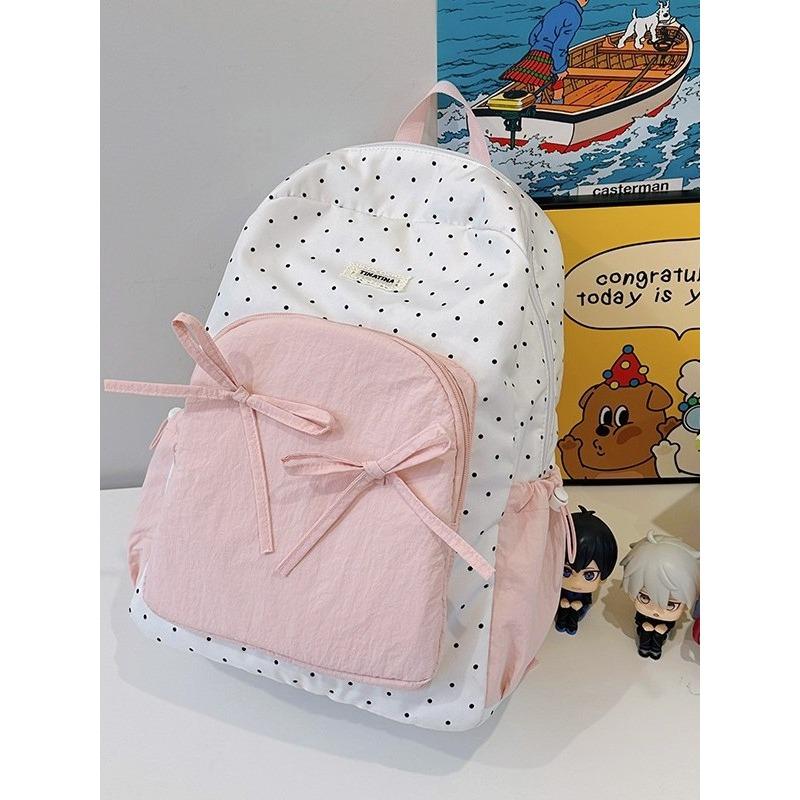 The new schoolbag is high-value, fresh and sweet, candy-colored polka dot bow backpack, junior high school backpack.