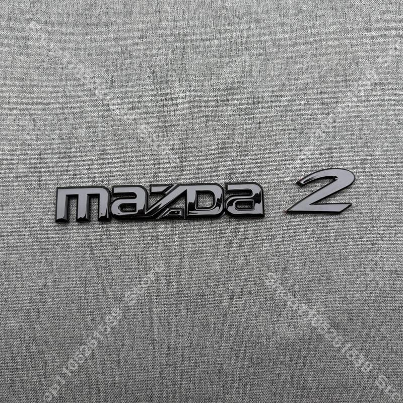 ABS Car Logo Front Grille Rear Trunk Steering Wheel Decoration Sticker For MAZDA2 2009- 2011-2015 16 17-2025 2026 MAZDA2 Emblem BBF3