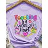Teaching Is A Work Of Heart Women's Tee - Colorful Teacher Graphic, Casual Purple Top