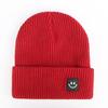 Autumn and winter smiley face labeling wool hat solid color couple versatile warm knitting classic casual hat men and women tide