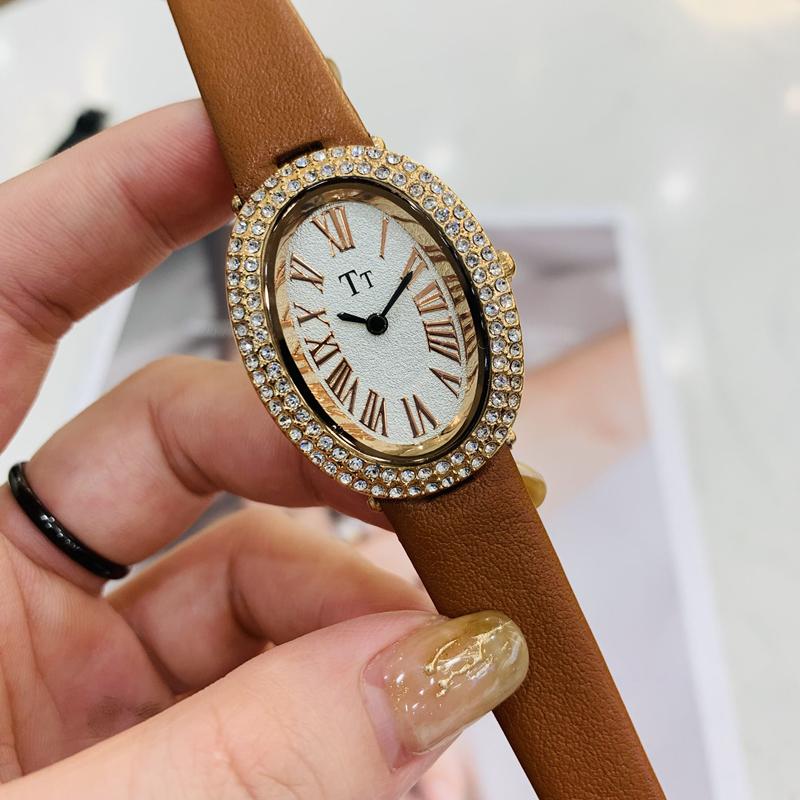 Oval-shaped women's watch with a vintage, luxurious feel and a high-end leather strap; fashionable quartz wristwatch.