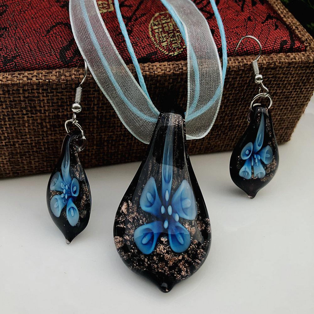 Trendy Blue Glass Ribbon Pendant Necklace & Earring Set - Perfect Seaside Vacation Accessory.