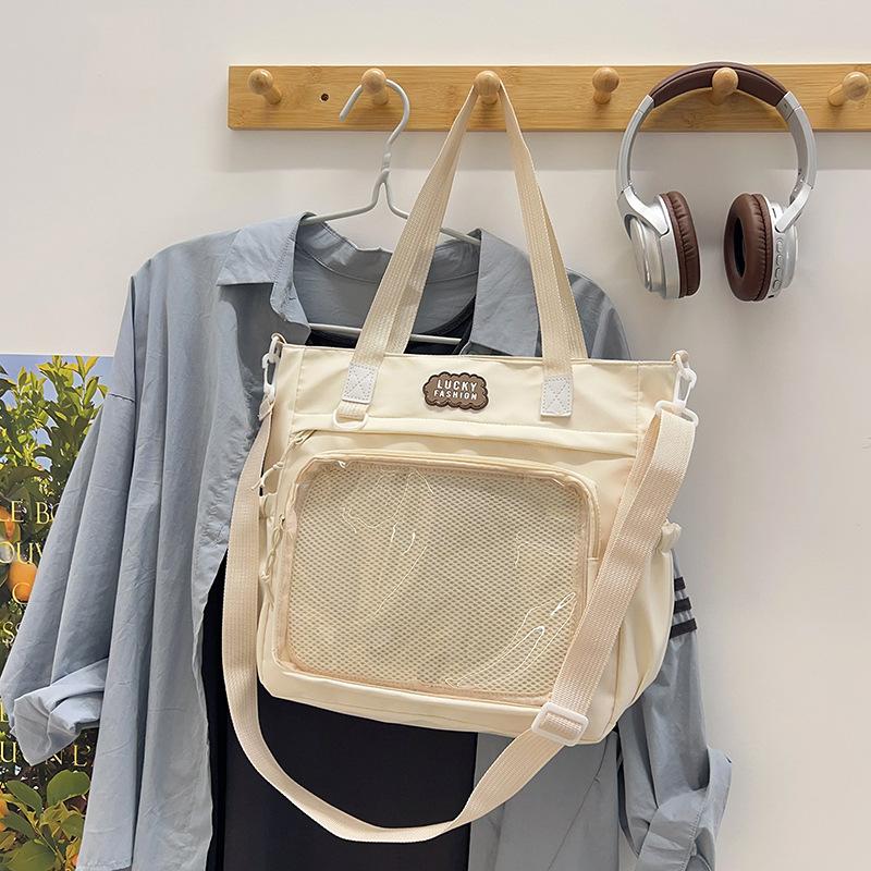 Japanische vielseitige hochwertige Umhängetasche im College-Stil, Soft-Girl-Tasche, Studenten-Make-up-Tasche, Schmerz-Tasche