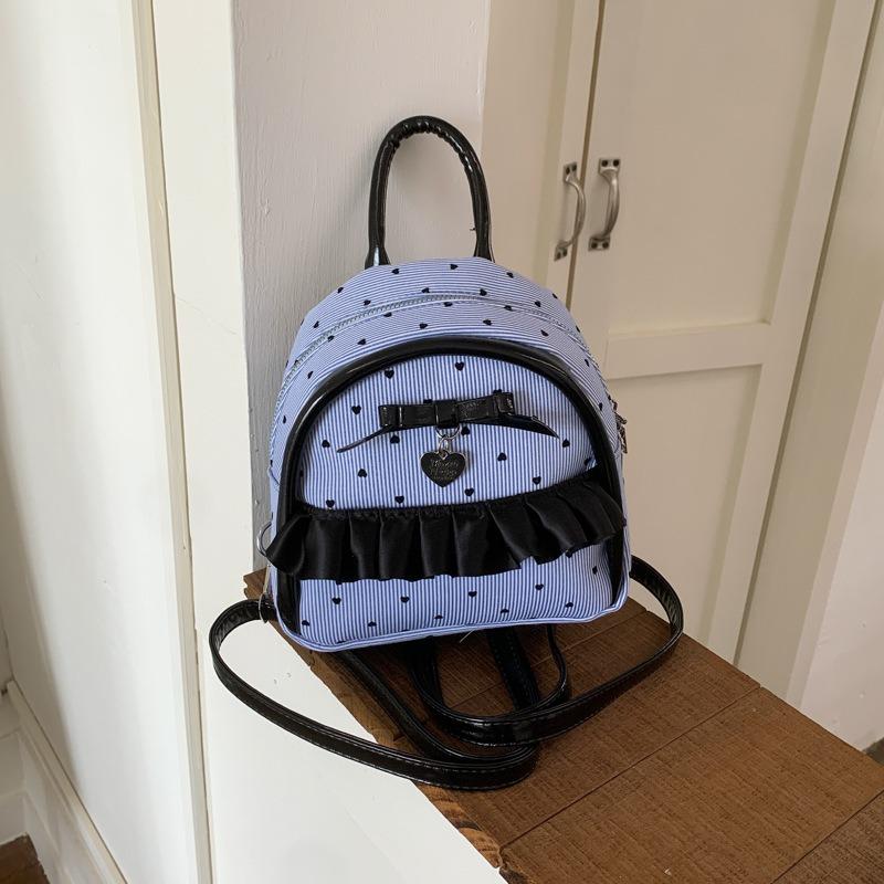 New college student schoolbag female junior high school student fashion polka dot backpack simple large capacity class commuter back