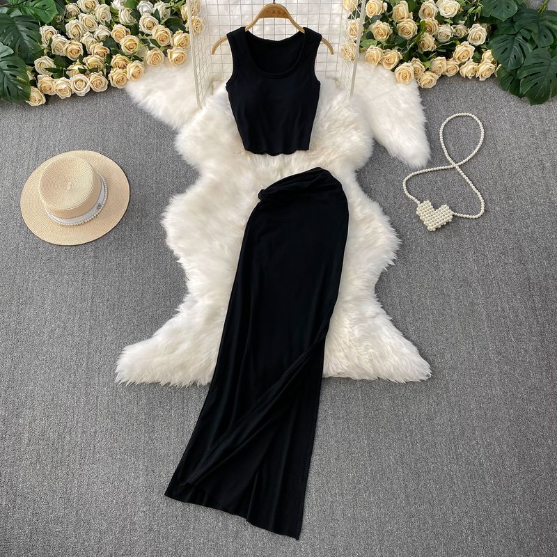 

Knitted U-Neck Sexy Short Sleeveless With Chest Pad Vest Top + High Waist Slimming Split Skirt Two-piece Suit Black One size