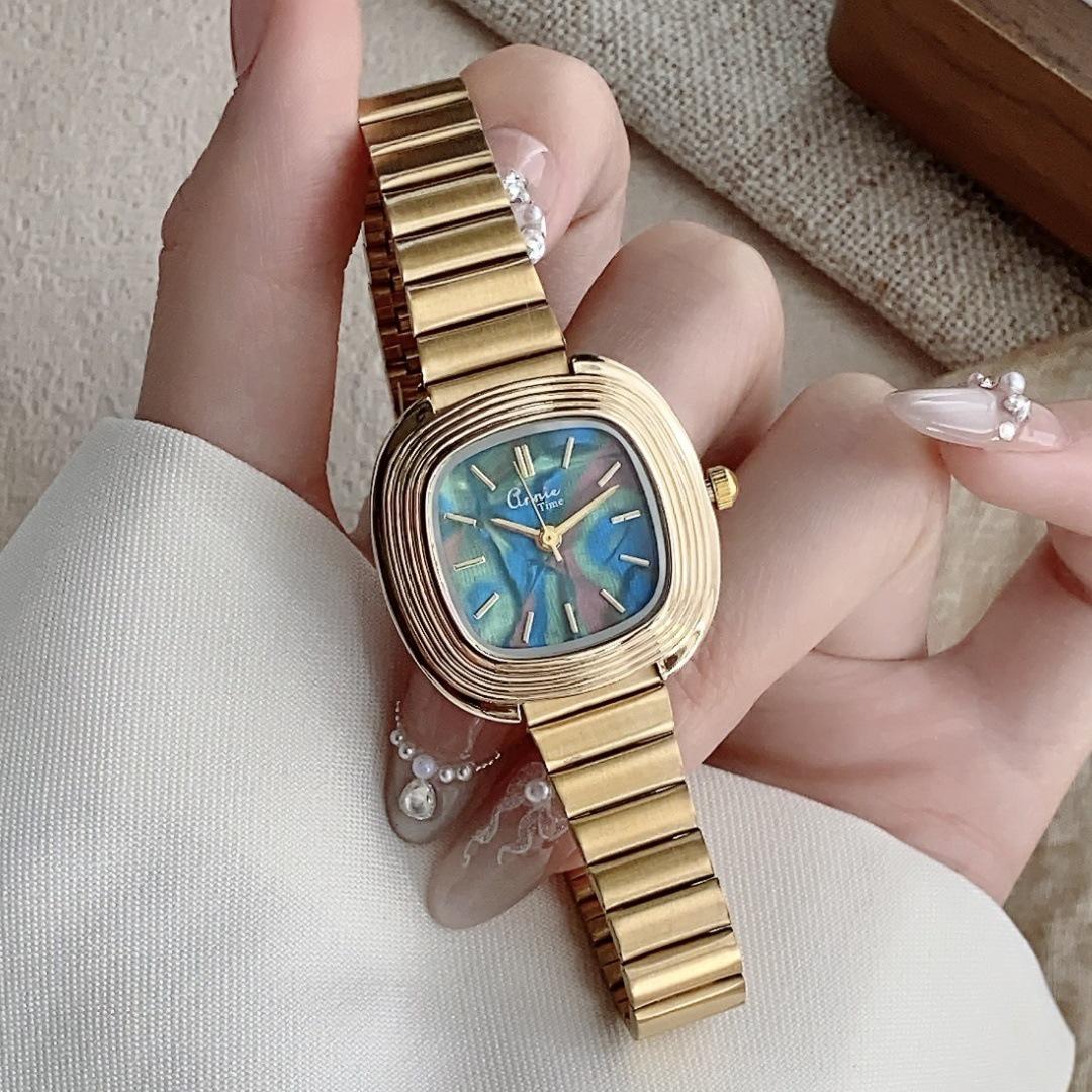 

Women s Gold Quartz Watch with Mother-of-Pearl Dial, Retro Bamboo-Link Steel Band, and High-End Design