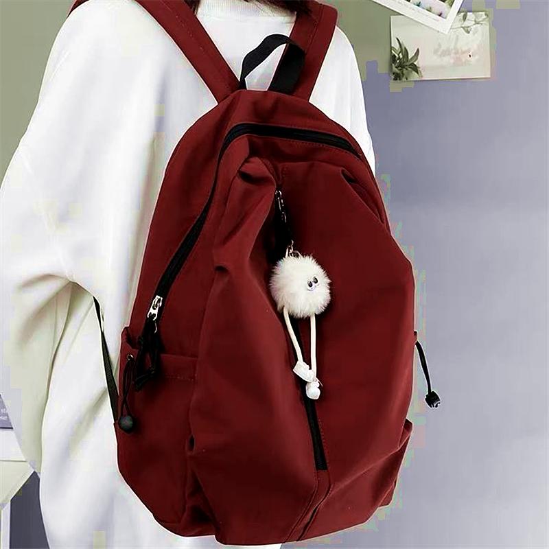 

Backpack for female college students simple lightweight and fashionable travel large capacity backpack for male high school stud червоний