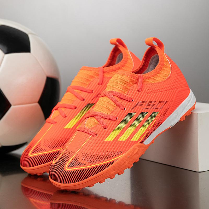 2025 new children's football shoes boys and girls broken nails T people grass students game training football shoes 31-40
