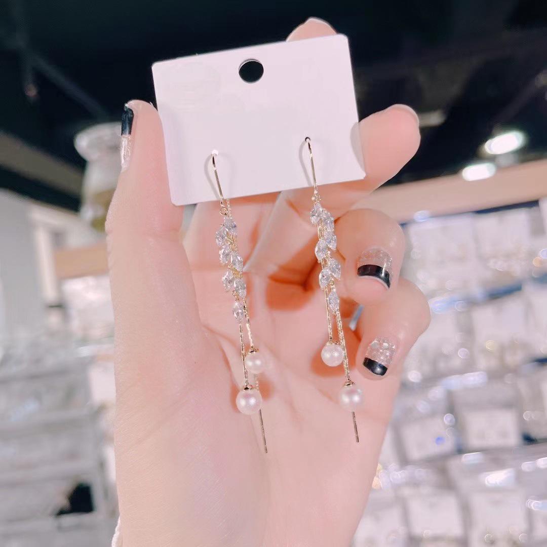 

Кисточка Кошачий глаз Цепочка для уха Тренд 2024: Элегантные длинные серьги с дизайном «легкая роскошь»