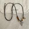 Stylish Alloy Accent Necklace With Sliding Closure Braided Cord and Natural Wood Materials