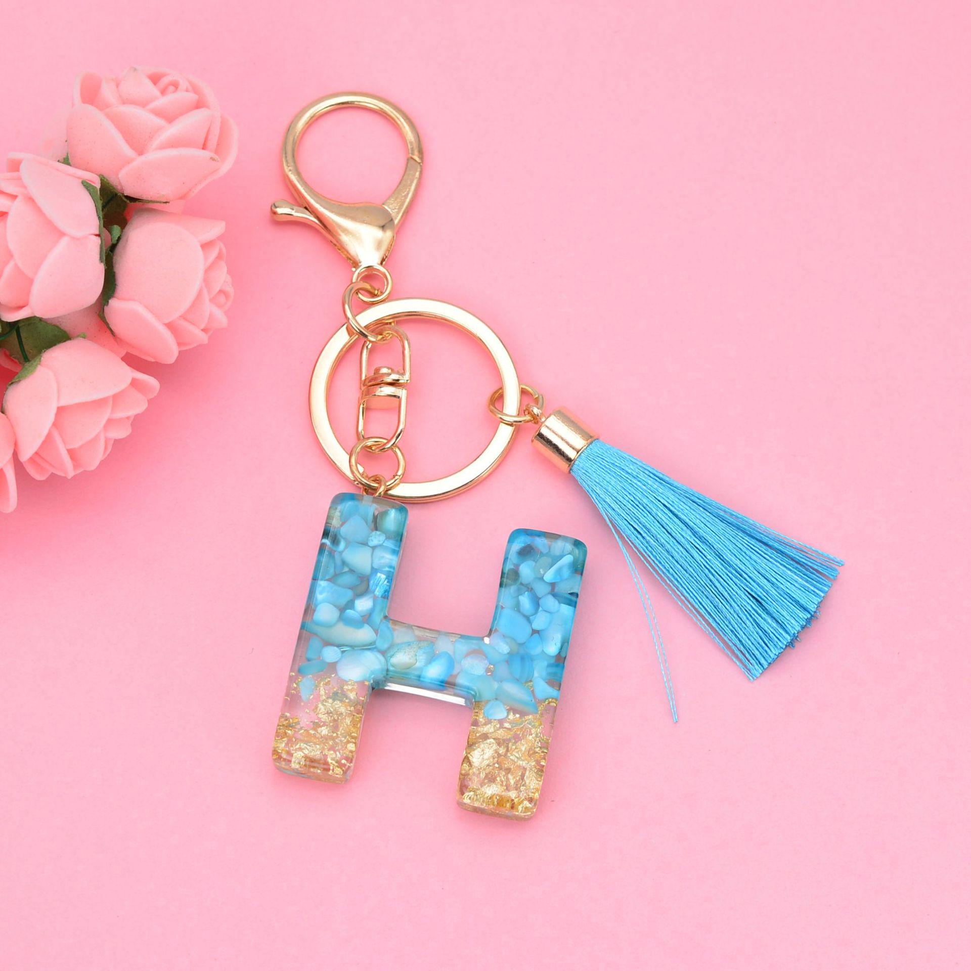 

Синий брелок с кисточкой и 26 подвесками в виде английских букв - подвеска-капля из смолы для сумок и автомобилей, унисекс.