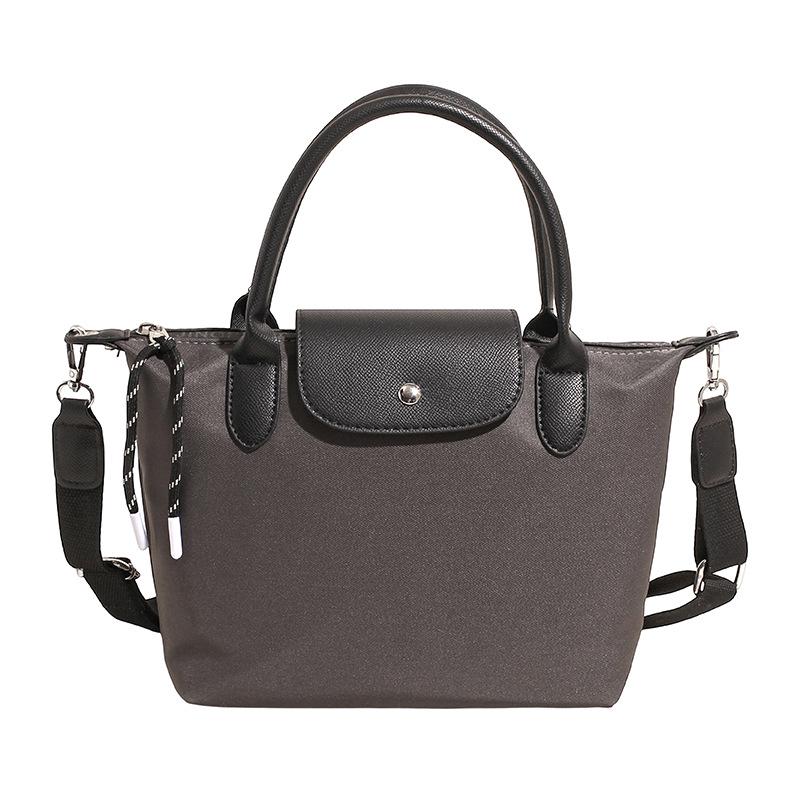 Minimalist Color-Block Oxford Cloth Handbag: Versatile, Fashionable Shoulder Bag with Unique Texture.
