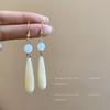 Silver Needle Cross-Border Tassel Earrings: Women's Versatile, Stylish Studs with a Unique, Trendy Design.