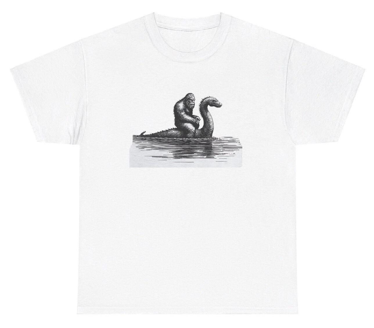 Bigfoot Riding Lochness Monster T Shirt Funny Mythical Creature Sasquatch Tee S