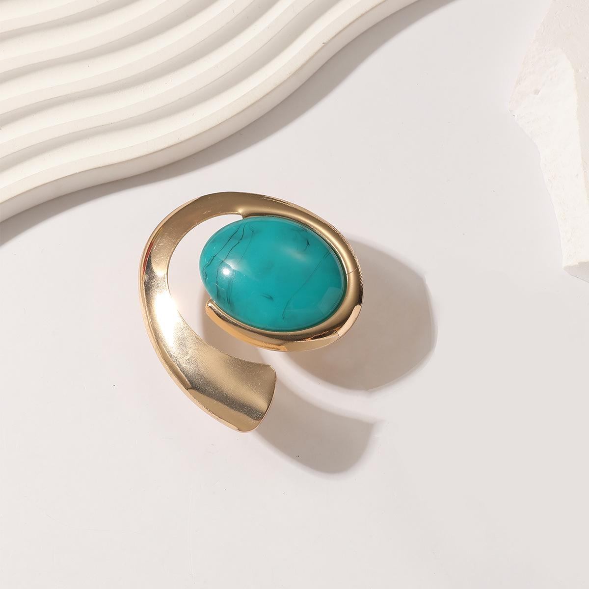 

Бірюзове відкрите кільце в стилі панк – ювелірний тренд високого класу золотий