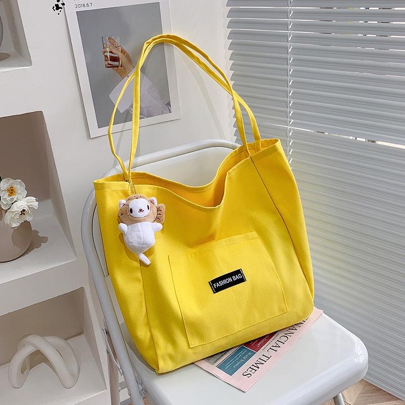

Candy color Korean version canvas bag women s casual versatile simple largecapacity tote bag single shoulder ins style student bag жёлтый