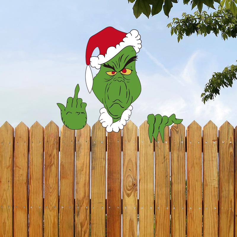 Grenzüberschreitende Weihnachtsdekoration mit Rentieren und Weihnachtsmann, Elch lugt aus dem Zaun