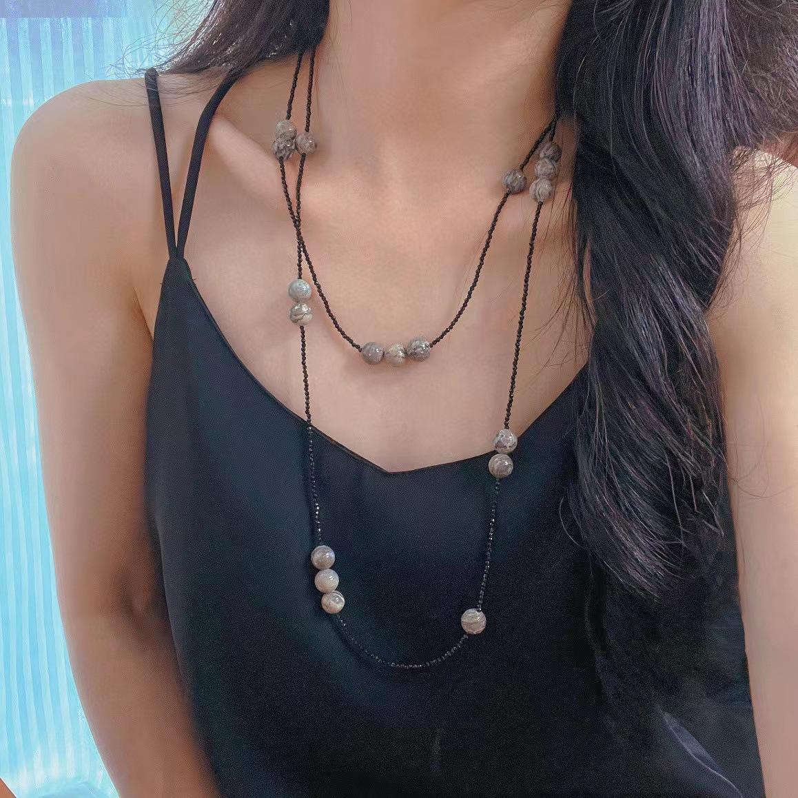 

Retro Autumn And Winter New Long Models, A Variety Of Wearing Methods, Black Spinel Map Stone, Natural Stone Sweater Chain, Niche