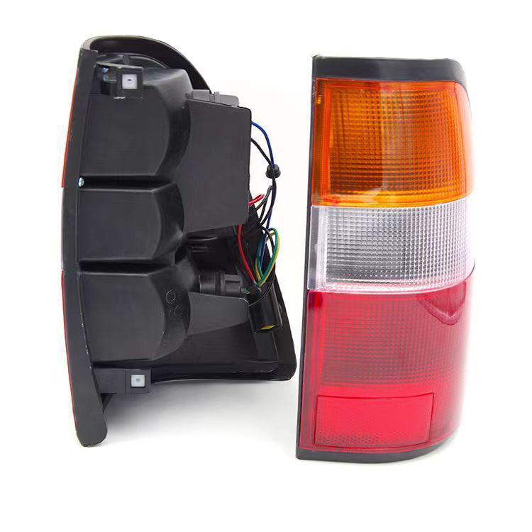 Isuzu Qingling Pickup Truck Rear Tail Light Assembly for 1998 Model - Includes Reverse and Brake Light Bulb.
