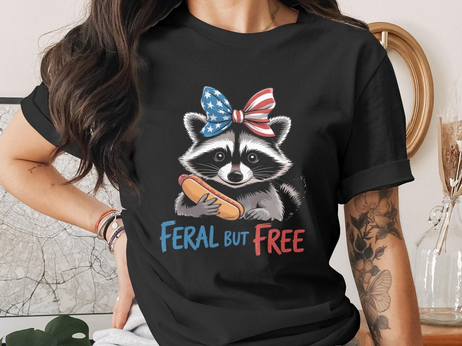 Feral But Free Raccoon T-Shirt, Patriotic Hot Dog Raccoon Tee, 4th of July USA Flag Bow Animal Lover Shirt, Summer BBQ Party Gift 4XL