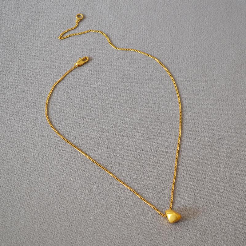 Gold-Plated Brass Pendant Necklace with Irregular Faceted Design - Retro, Versatile, and Stylish.