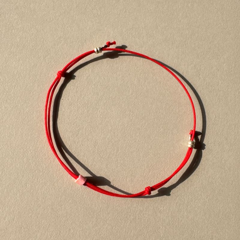 

emotive [cotton] Pink on Red bracelet Pink on Red bracelet