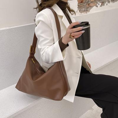 Eine Damen-Retro- und Trendtasche mit großem Fassungsvermögen, eine Umhängetasche zum Tragen über der Schulter für häufige Studentenkurse
