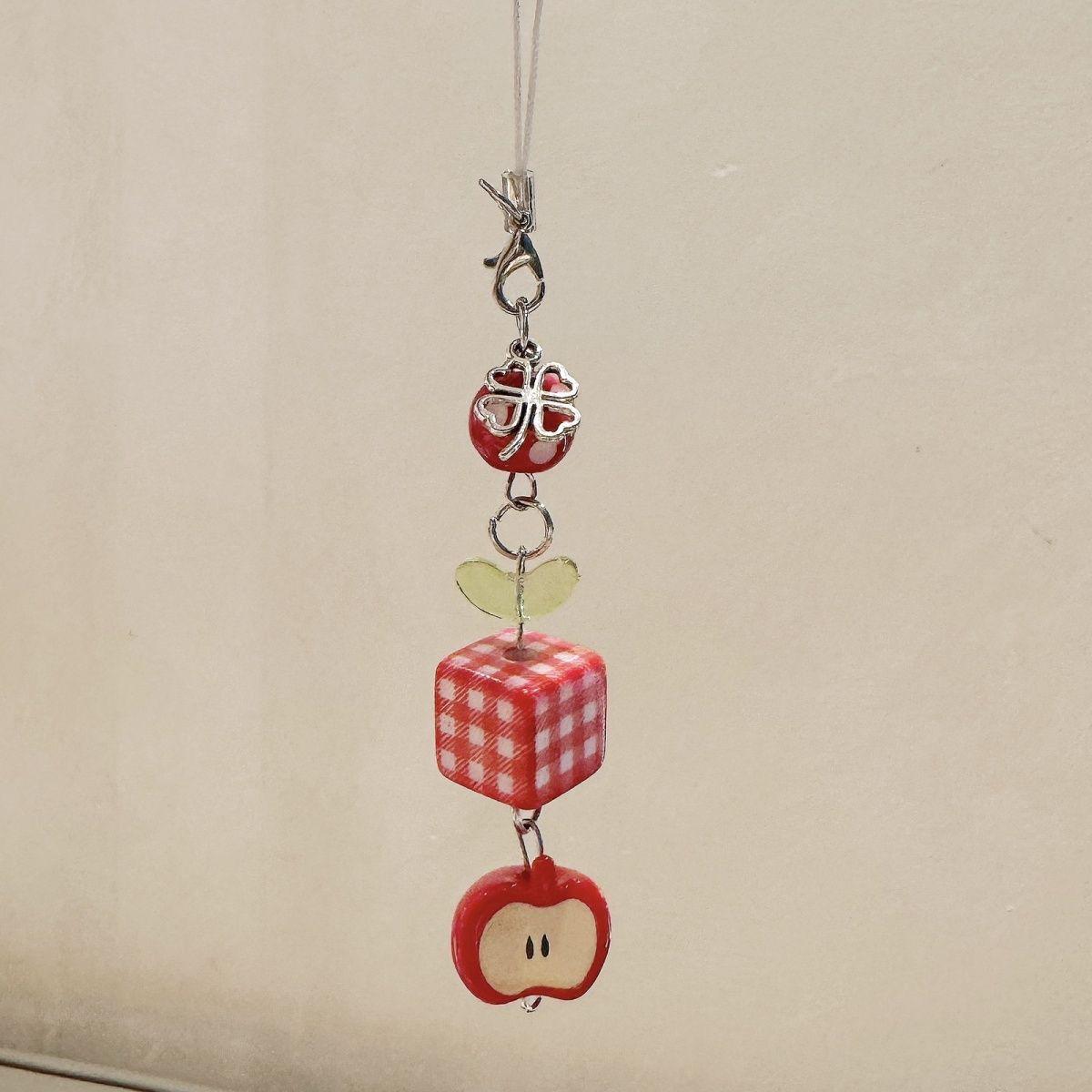 

Adorable Apple Beaded Wind Chime Phone & Bag Charm – Handmade, DIY, Stylish Accessory