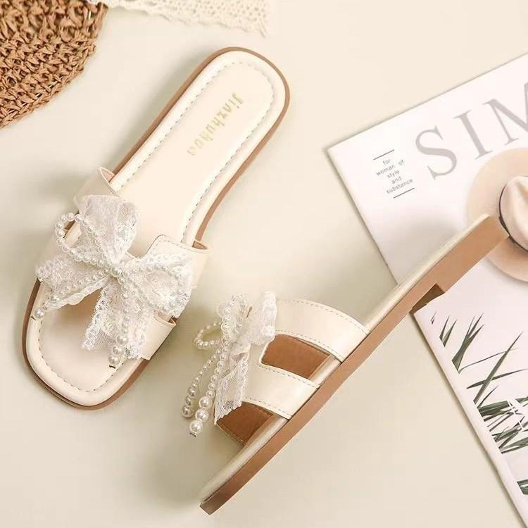 Fairy wind bow pearl slippers female 2025 summer new Korean version of Internet celebrity flat bottom square head cool slippers