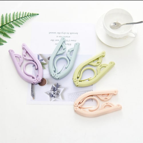Four clip-on portable hangers and one folding hanger for easy storage. Ideal for travel, business trips, and indoor laundry drying. (4 colors availabl