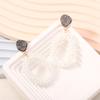 European, American Bohemian fashion and popular style handmade high-end rice beads geometric oval earrings with elegant and atmospheric temperament