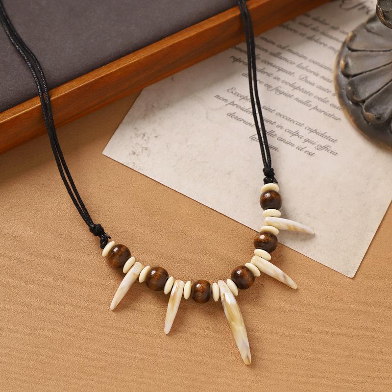 Hand-woven imitation wolf tooth wood bead necklace, retro niche dog tooth tribe men's and women's personalized sweater accessories