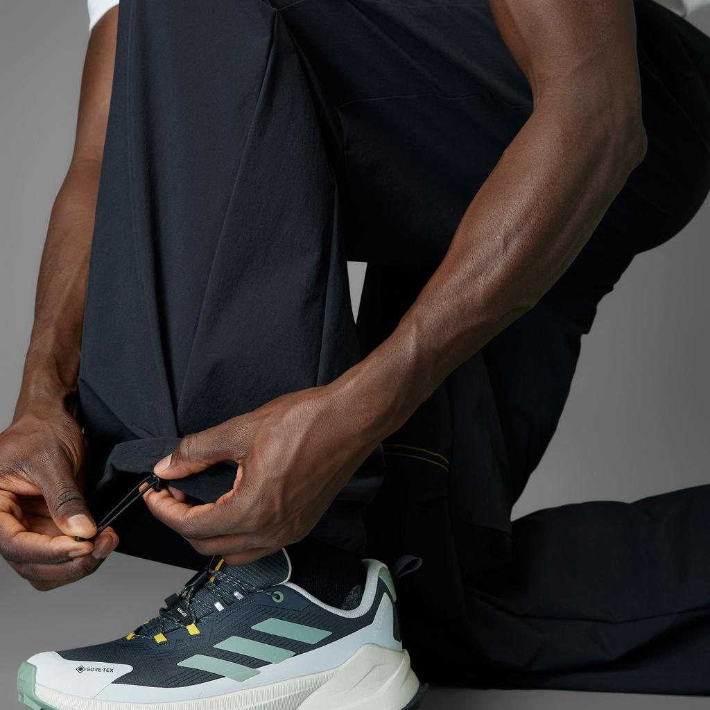 Adidas X تعاون ناشونال جيوغرافيك بنطال رياضي منسوج بتقنية A.R مريح ولطيف على البشرة بنطال كاجوال رجالي أسود KA3278